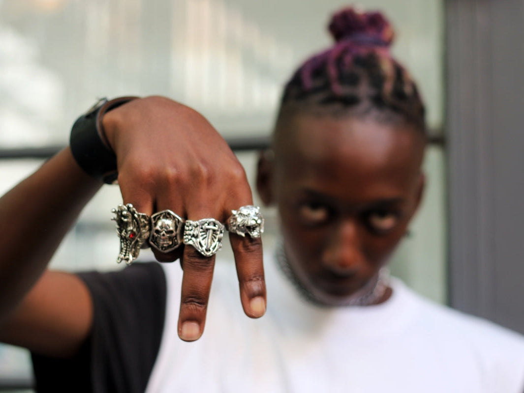 man in white crew neck shirt wearing silver diamond ring