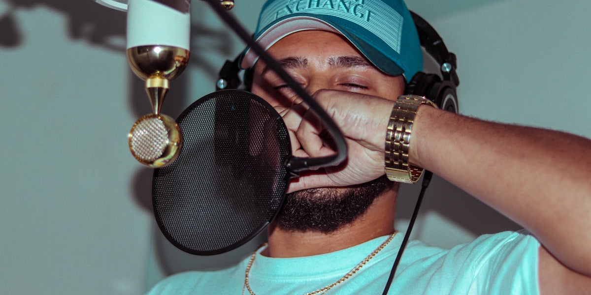 man in white crew neck t-shirt wearing blue and white fitted cap
