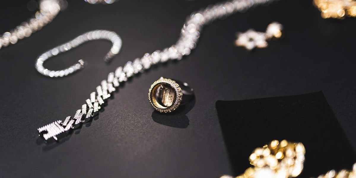 a table topped with lots of different types of jewelry