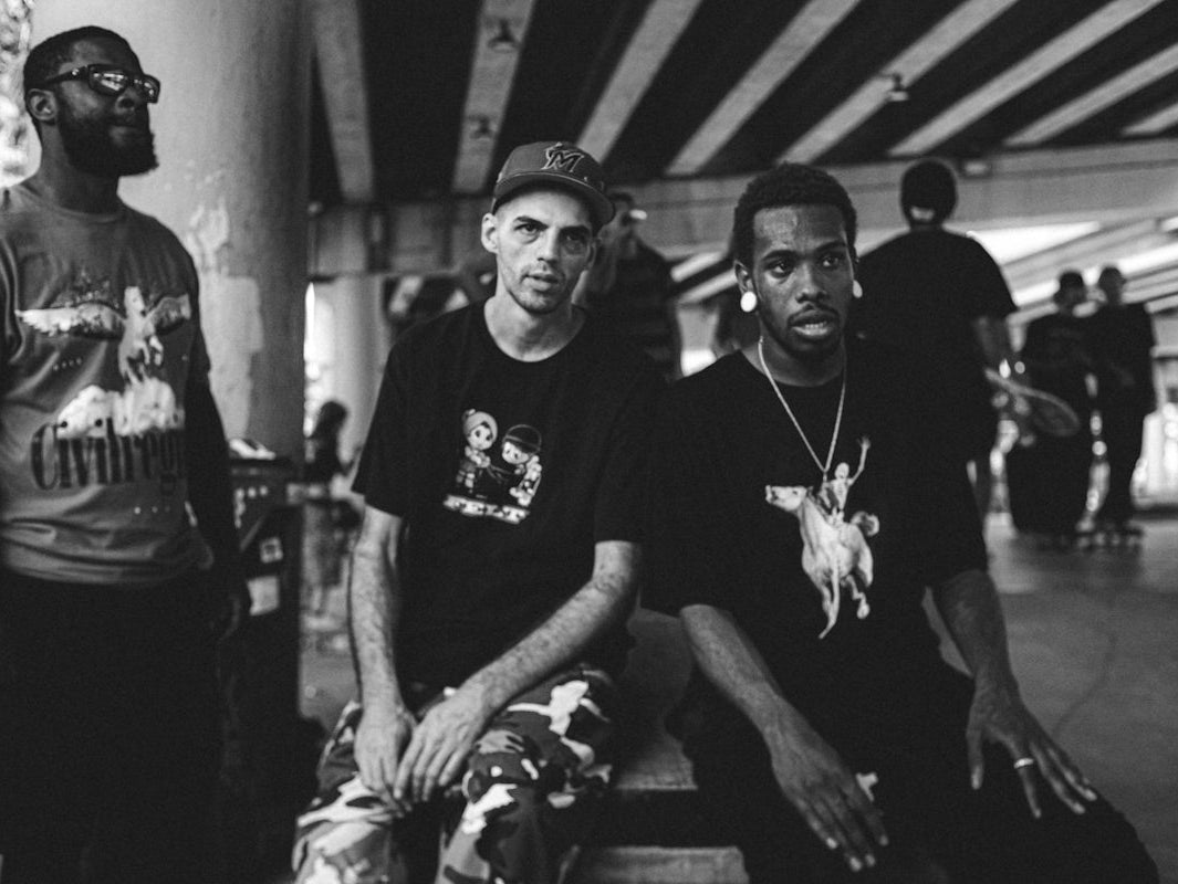a group of young men sitting next to each other