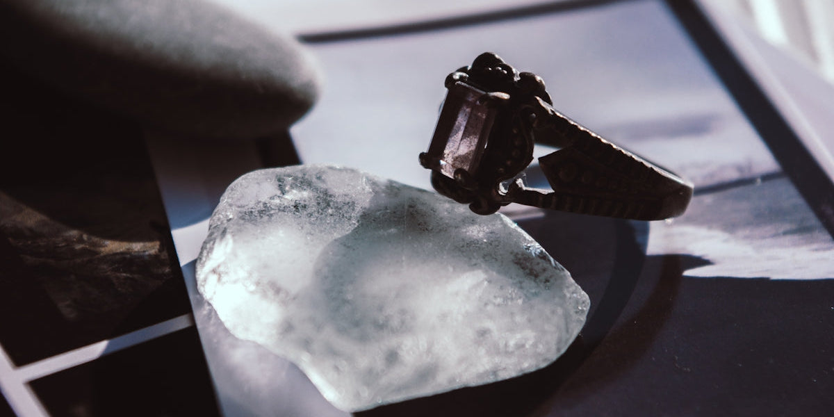 a ring sitting on top of a piece of ice