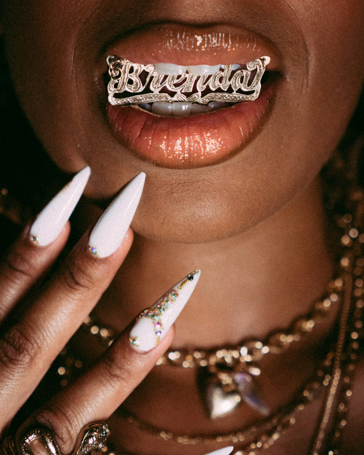 a close up of a person with white nails