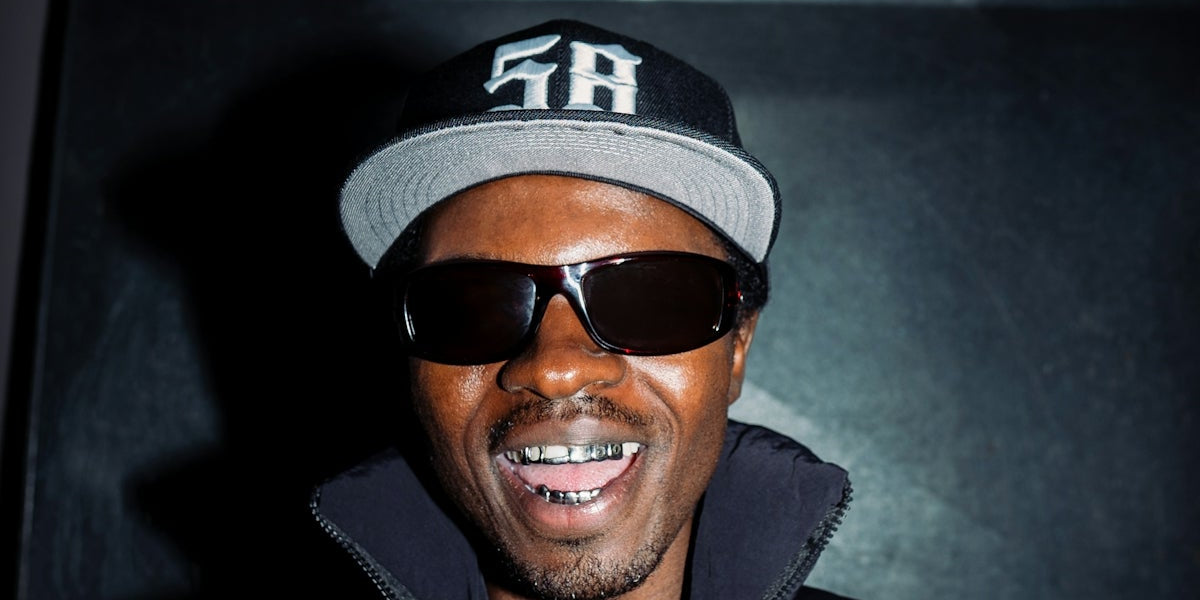 Man wearing sunglasses and a baseball cap