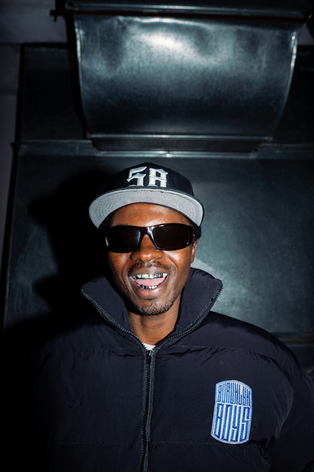 Man wearing sunglasses and a baseball cap