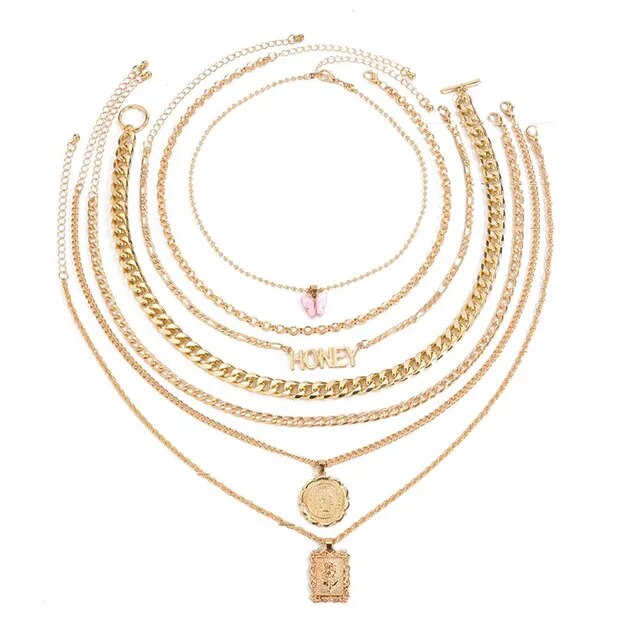 The Luxe Butterfly Honey Necklace Set: Embrace the epitome of luxury with this seven-piece ensemble