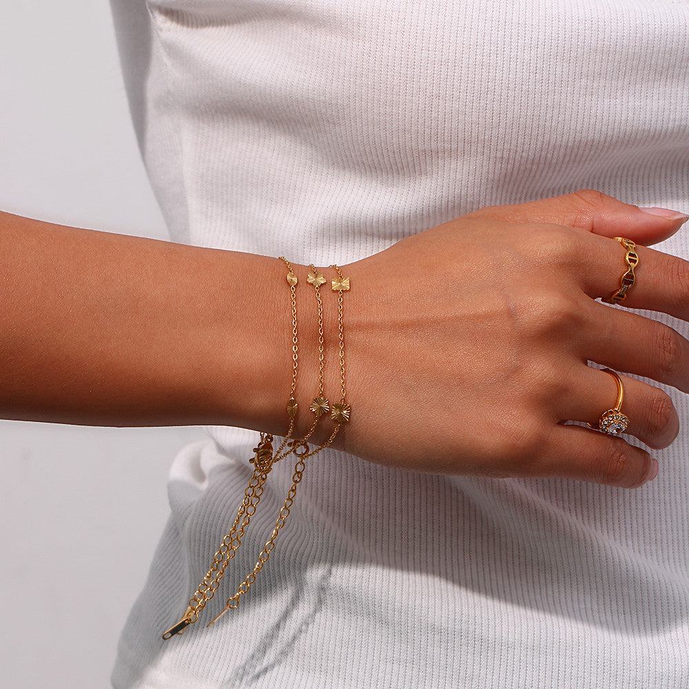 Ladies 18k Gold Over Stainless Steel Waterproof Sunburst Oval Flower Charm Bracelet