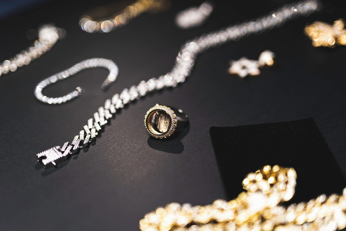 a table topped with lots of different types of jewelry