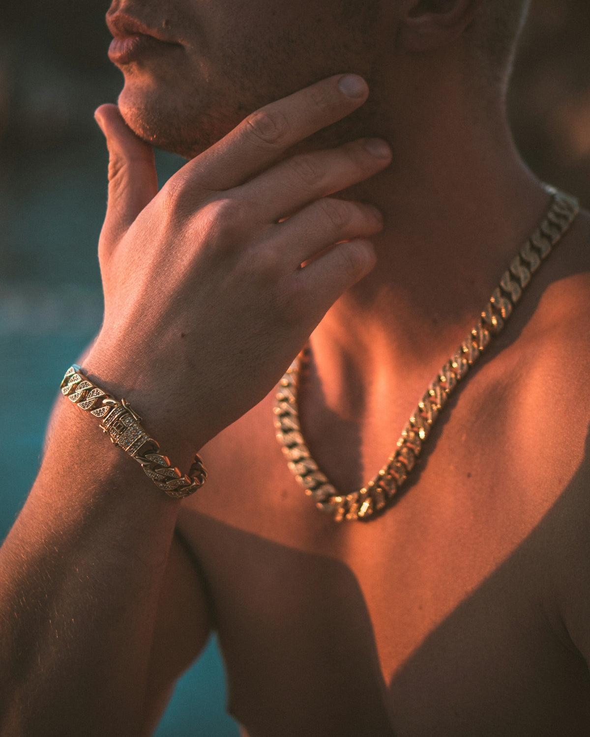 a man wearing a gold chain around his neck