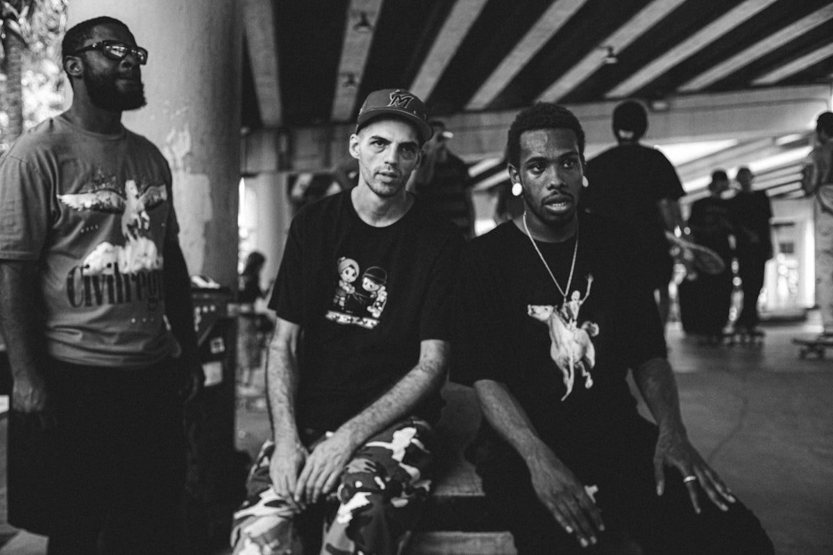 a group of young men sitting next to each other