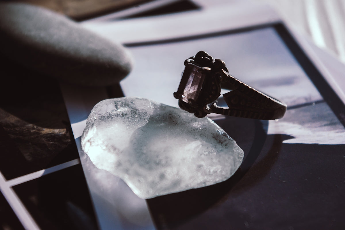 a ring sitting on top of a piece of ice
