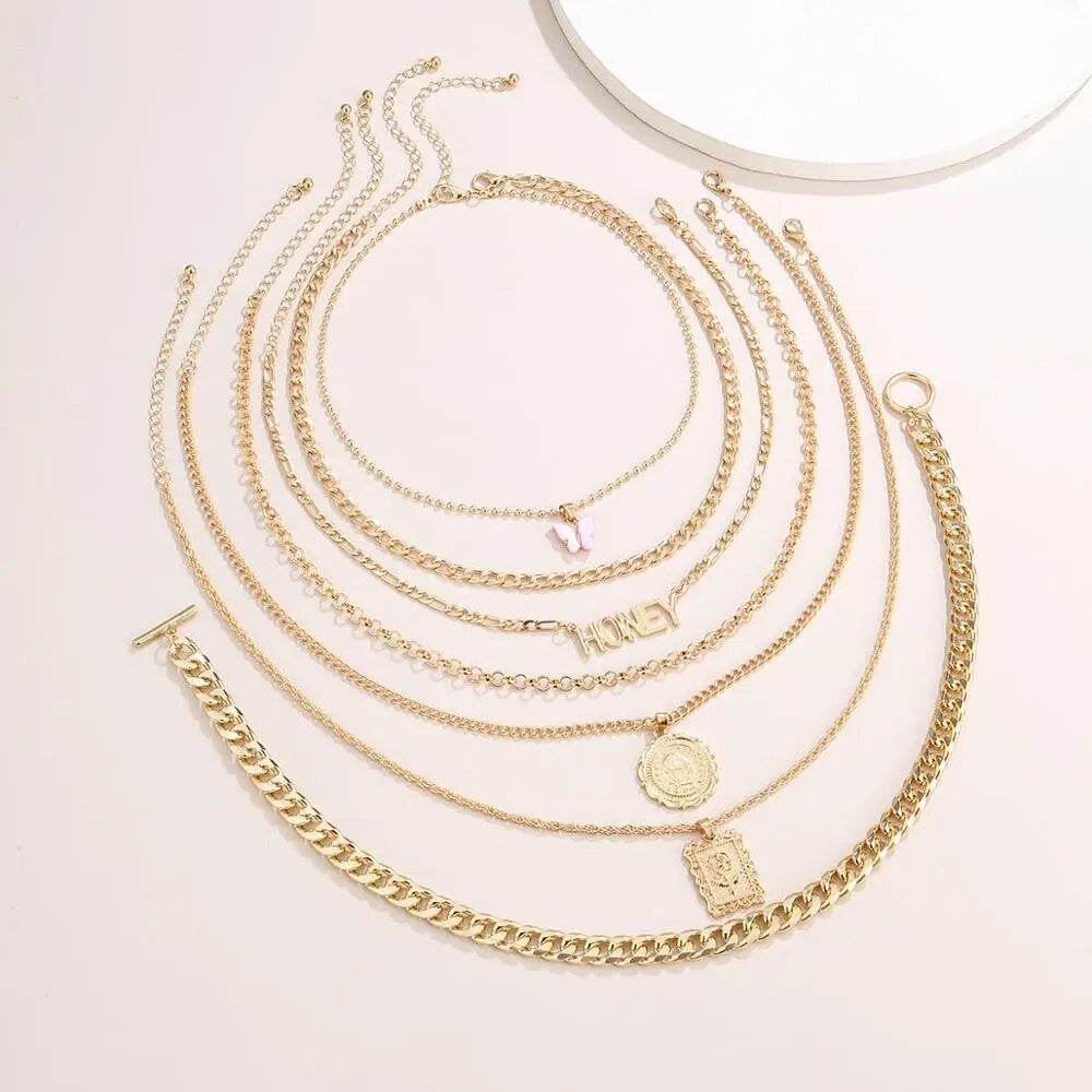 The Luxe Butterfly Honey Necklace Set: Embrace the epitome of luxury with this seven-piece ensemble