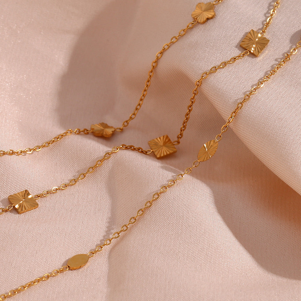 Ladies 18k Gold Over Stainless Steel Waterproof Sunburst Oval Flower Charm Bracelet